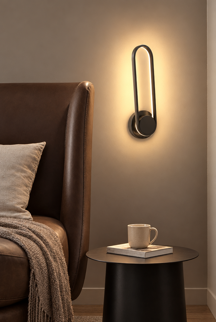 Svart vridbar vägglampa med oval ljusslinga
